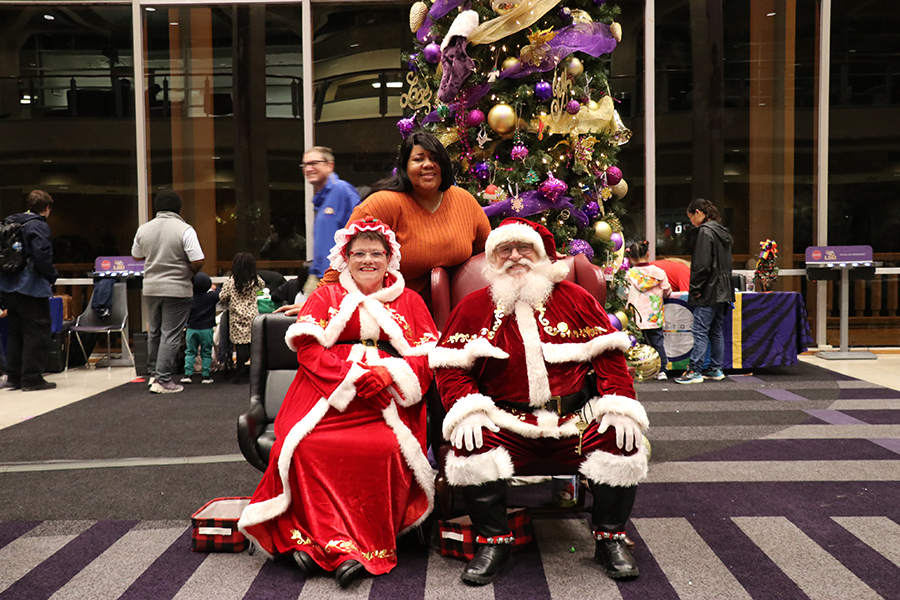 woman with Santa and Mrs. Claus