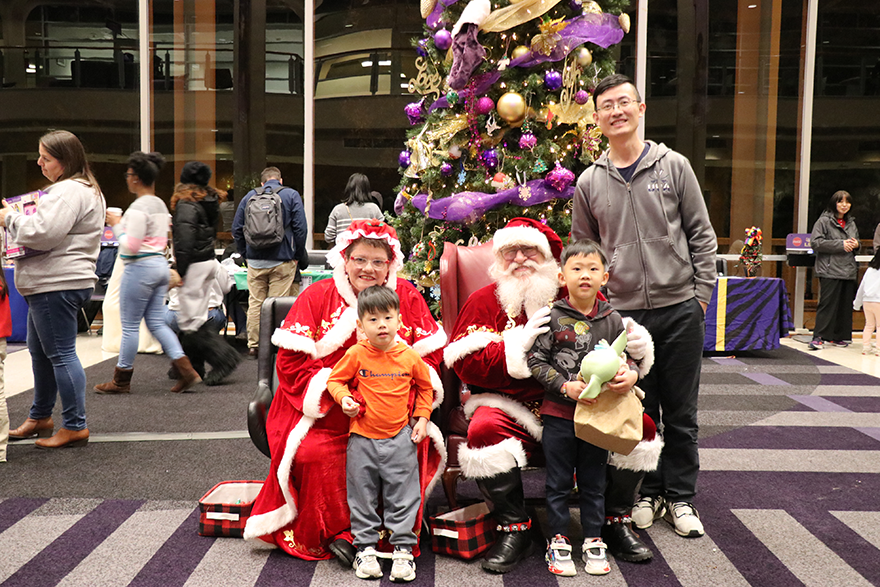 family with Santa and Mrs. Claus