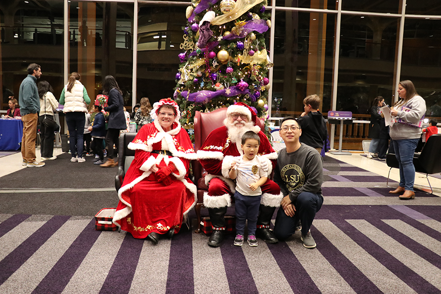 family with Santa and Mrs. Claus