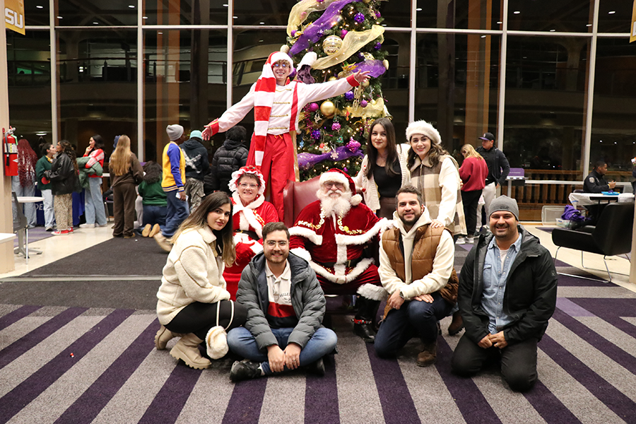 family with Santa and Mrs. Claus
