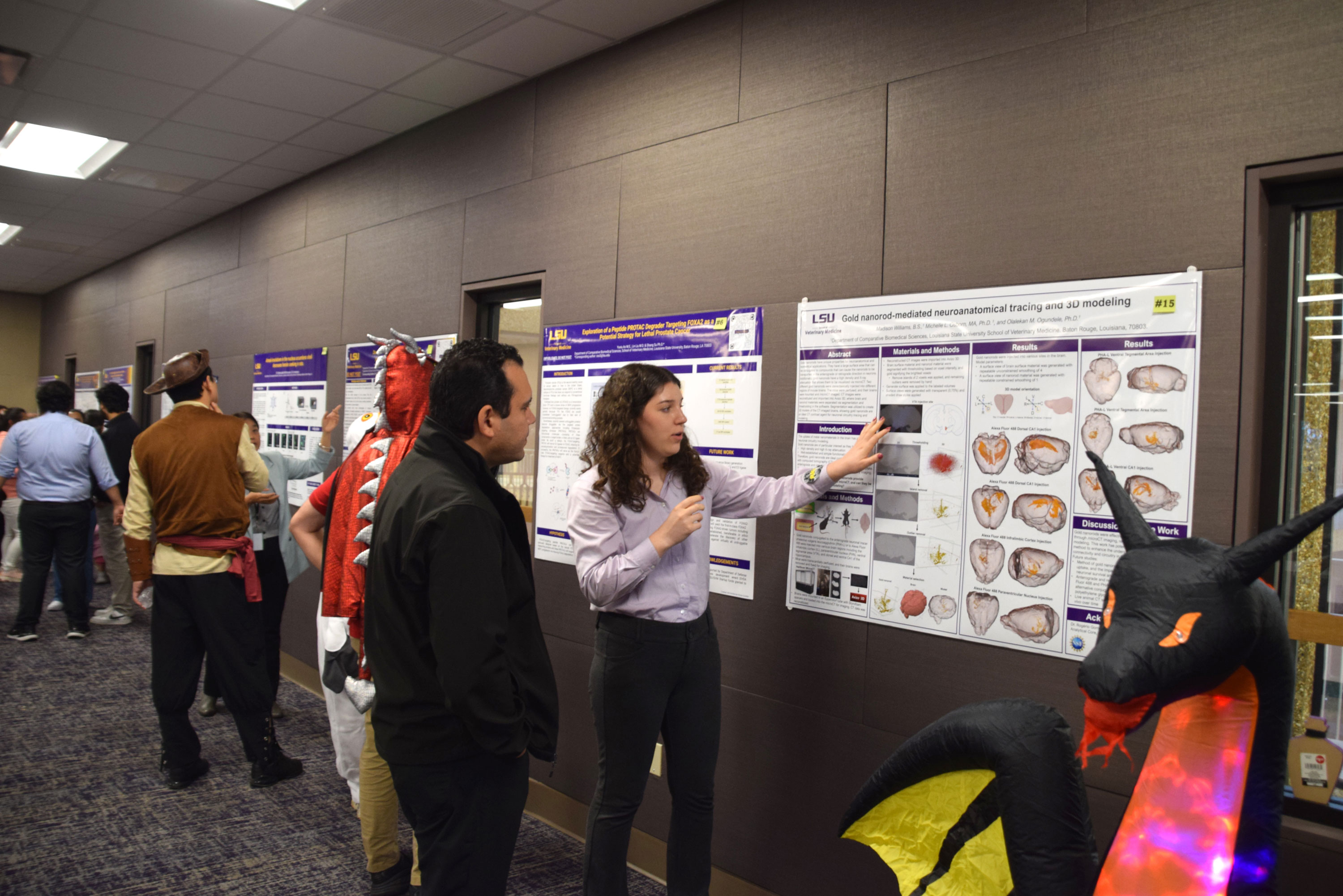 grad student explaining poster
